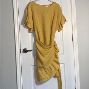 A yellow wrap dress.